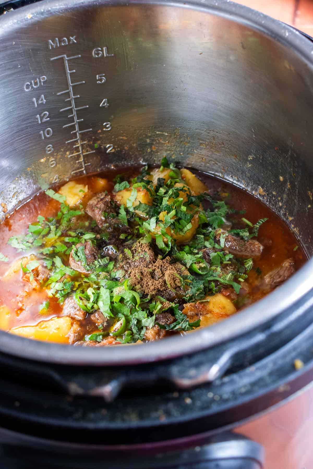 fresh herbs added to biryani masala in the instant pot