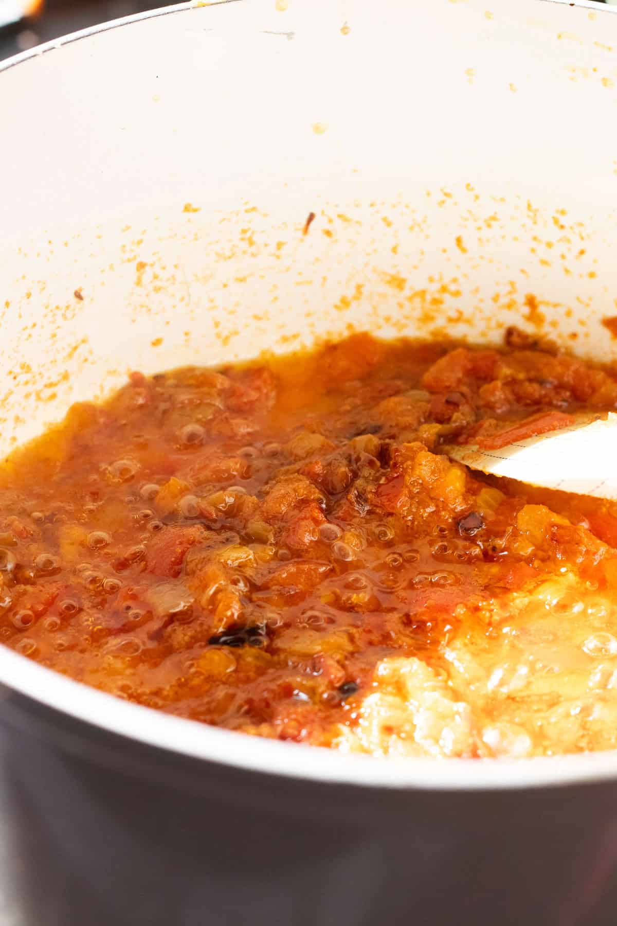 tomatoes added to the onion masala for the aloo gosht and cooked down.