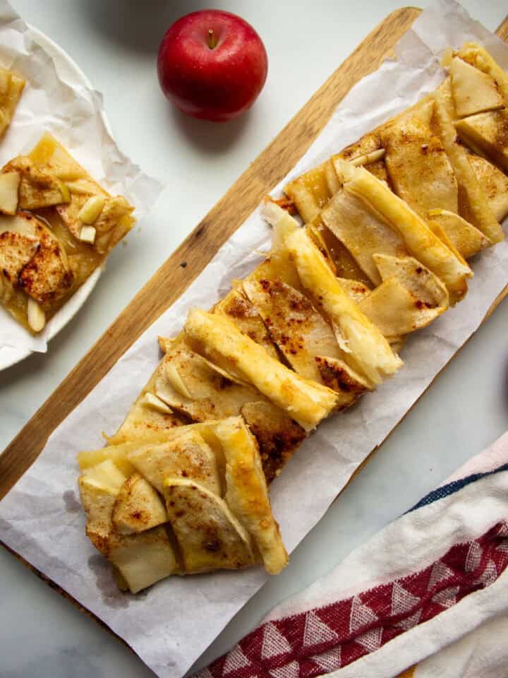 a long rectangular tray with apple tart squares
