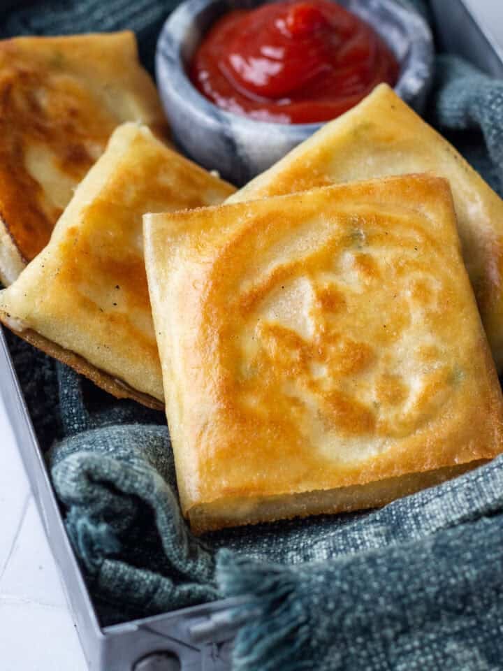 Box Patties in a metal tray with ketchup