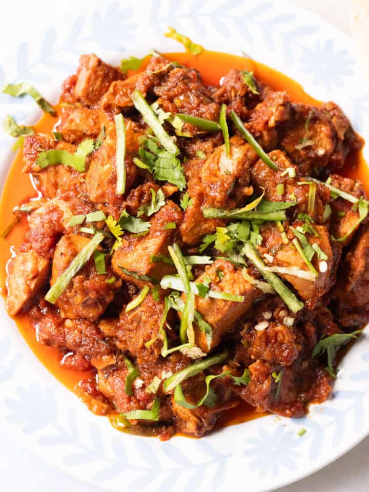 boneless chicken masala with a triangle of roti