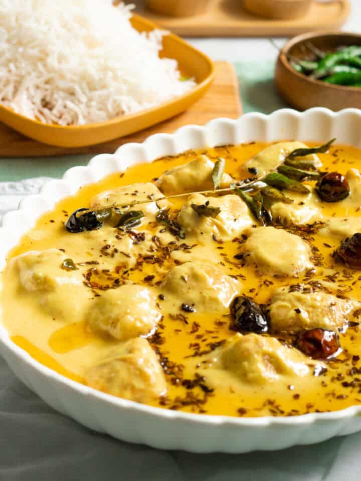 kadhi pakora in a white dish, rice in the background